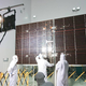 Technicians conducting an illuminating test on one of the Juno spacecraft’s solar array panels. Image: NASA/Jack Pfaller